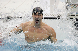 Michael Phelps celebrates winning the 100 fly and gold medal number seven at the Beijing Olympics